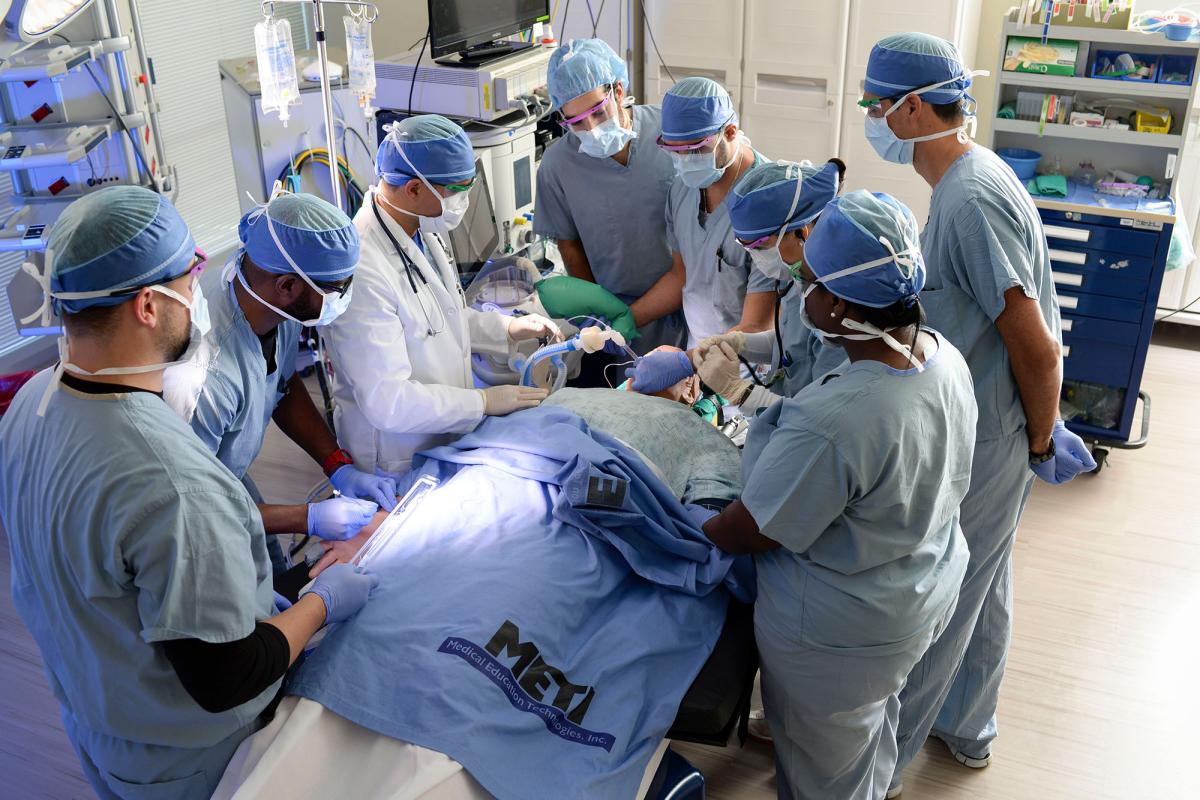 A group of students participating in a simulation in our operating room simulation center.