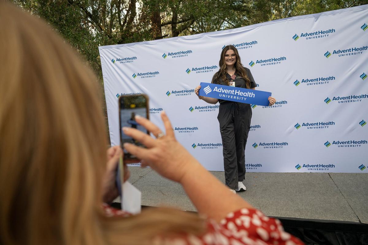 An AHU nursing student celebrates the opening of the new Tampa location.
