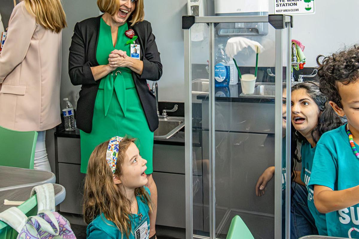 Bobbie Jean Cabezas smiles at children at the Orlando Science Center event