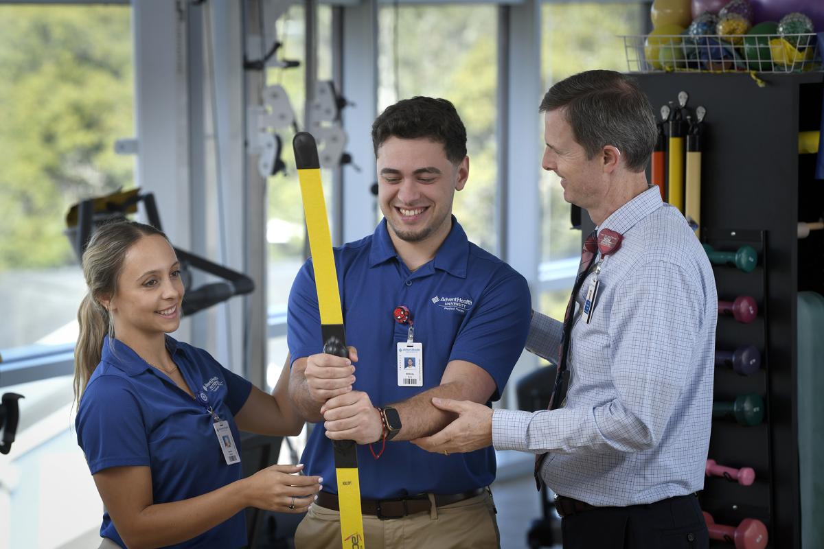 Physical Therapy students demonstrating equipment