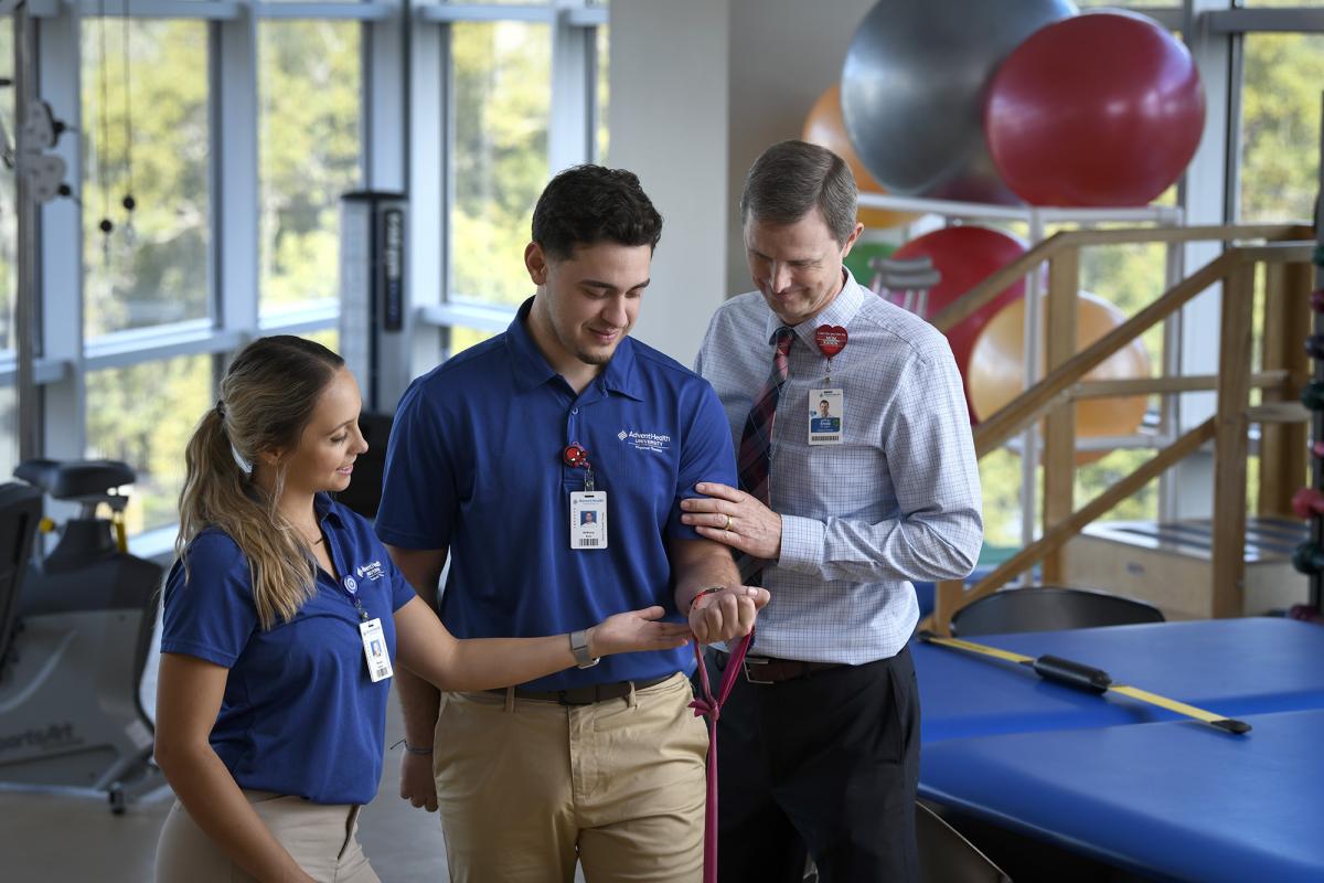 Physical Therapy students using an exercise band