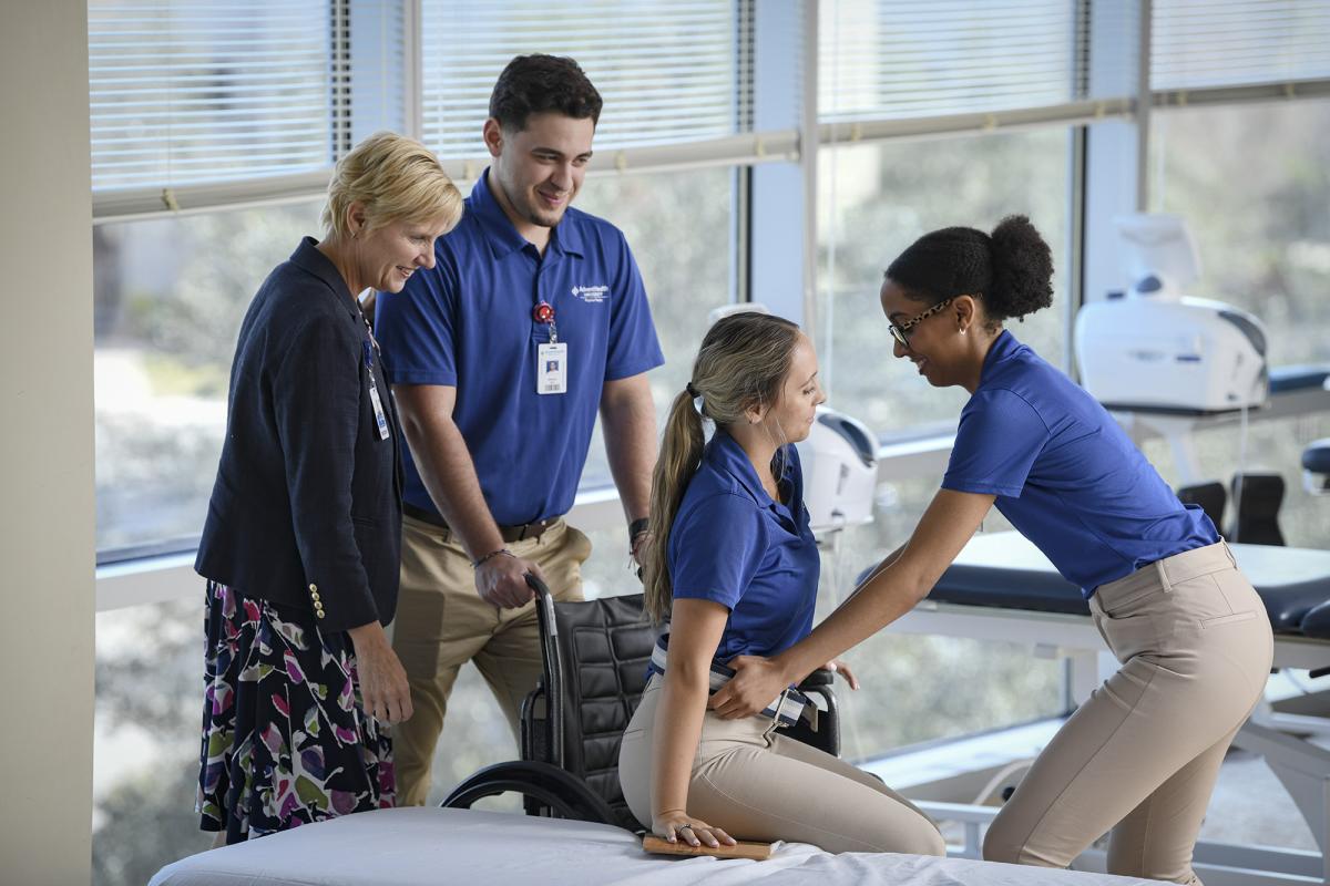 Physical Therapy students and professor demonstrating wheelchair use