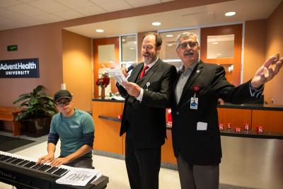 Lonnie-Mixon-and-Dr. Ghosn-singing-Christmas-carols