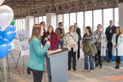 Chief Operations Officer Katie Shaw delivering speech at blessing ceremony