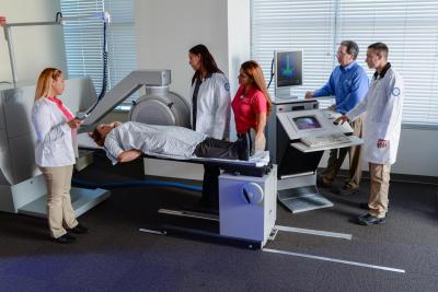 A group of people in a Nuclear Medicine Lab