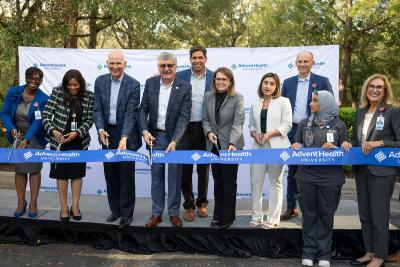 Leaders from AdventHealth and AHU cutting the ribbon at AHU Tampa