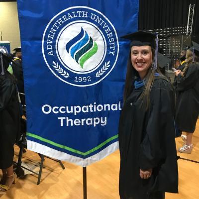 Image of Bryn Nadeau a graduate of the occupational therapy program in regalia.