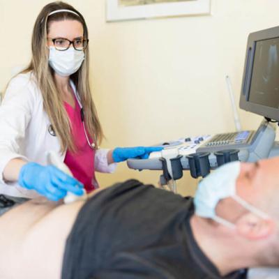 sonographer-examining-patient