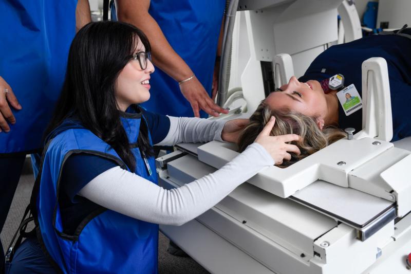 radiography students in radiography lab using equipment