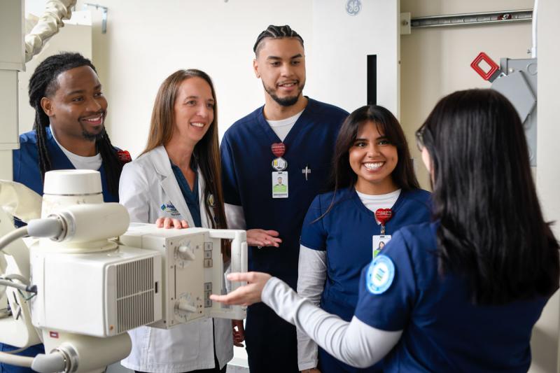 Professor and students in radiography lab