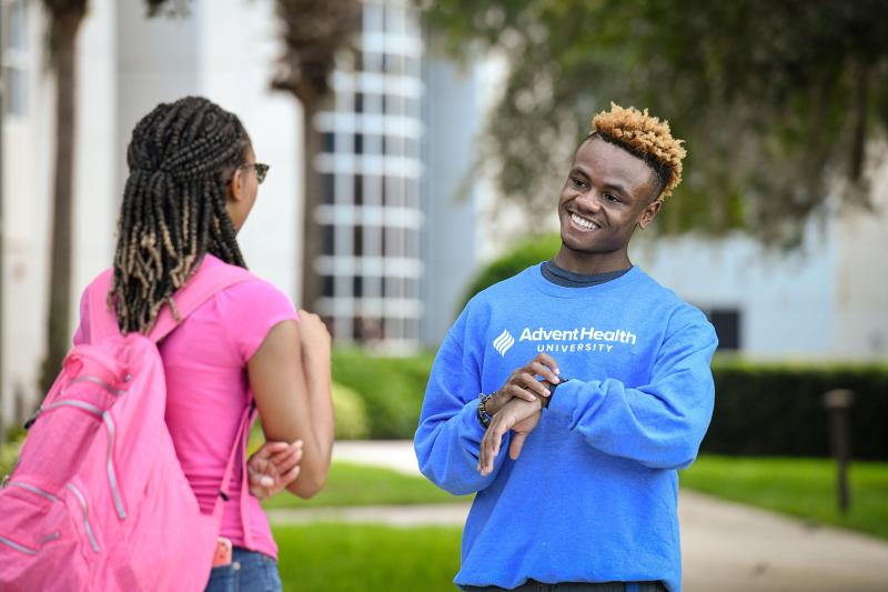 A student wearing an AHU sweater