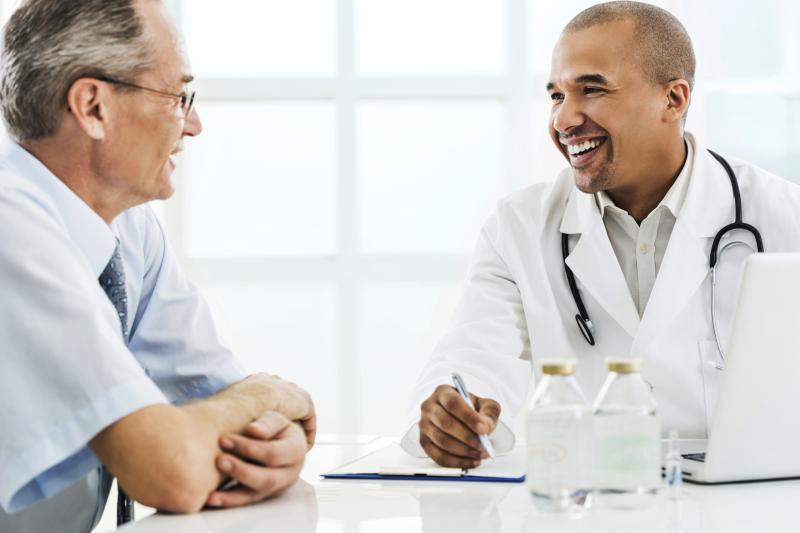 Older patient talking with doctor
