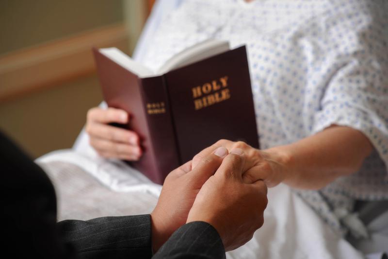 Chaplain with patient