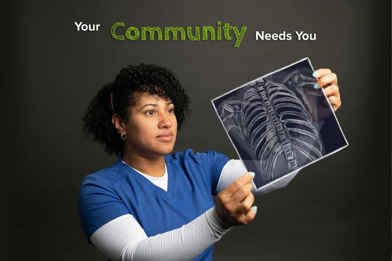 A health care student examines and X-ray image