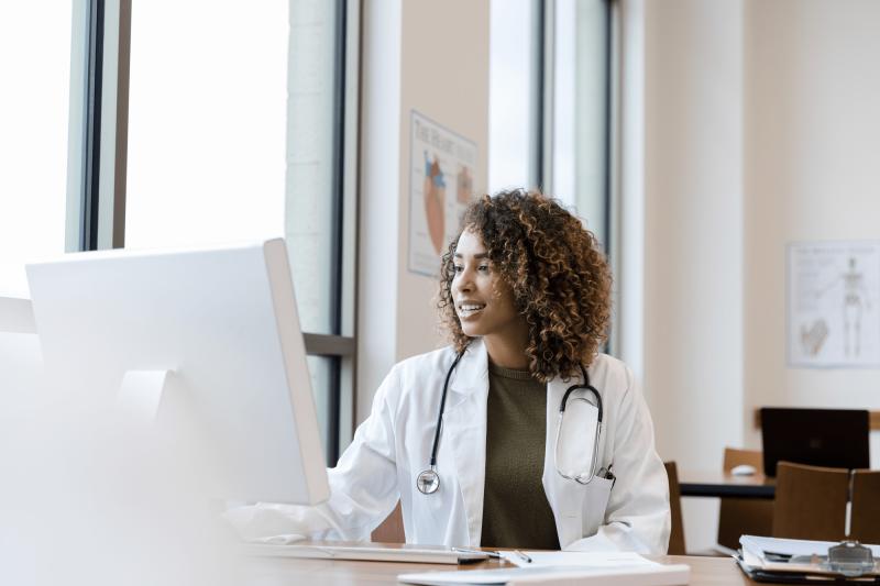 Female Physician using computer