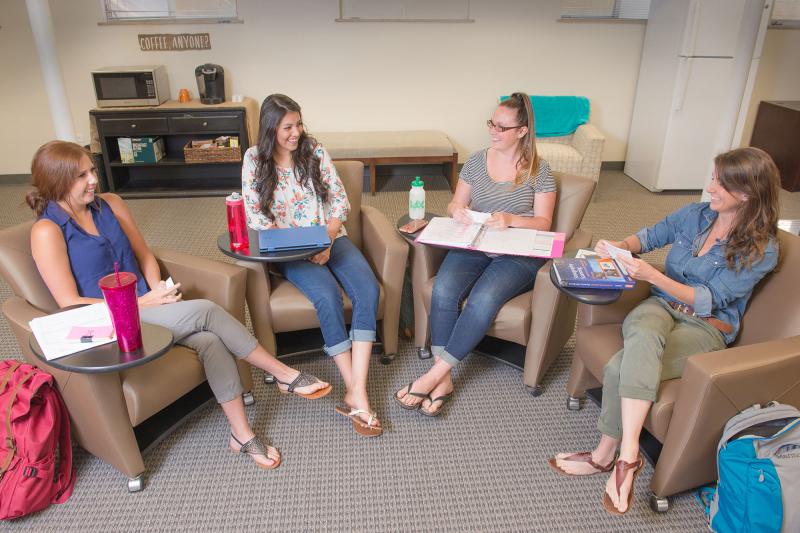 A group of students in a classroom discussion