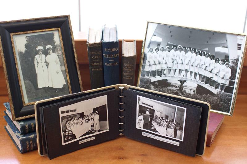Frames and photo albums containing pictures from Florida Hospital School of Nursing