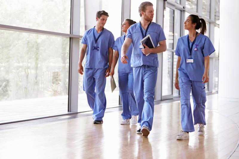 a group of nurses walking