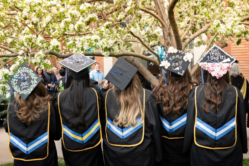 A group of graduates from AHU Denver