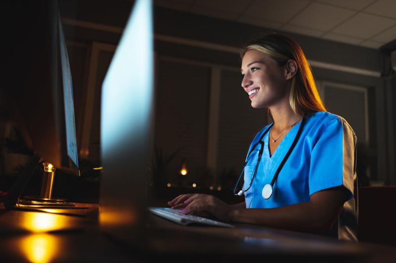 A nurse working on a computer
