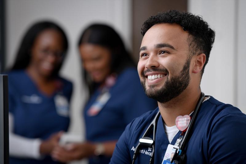A young male nurse smiling