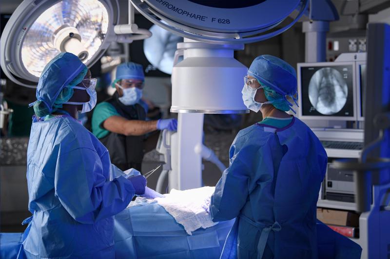 Surgeons and radiographers in an operating room