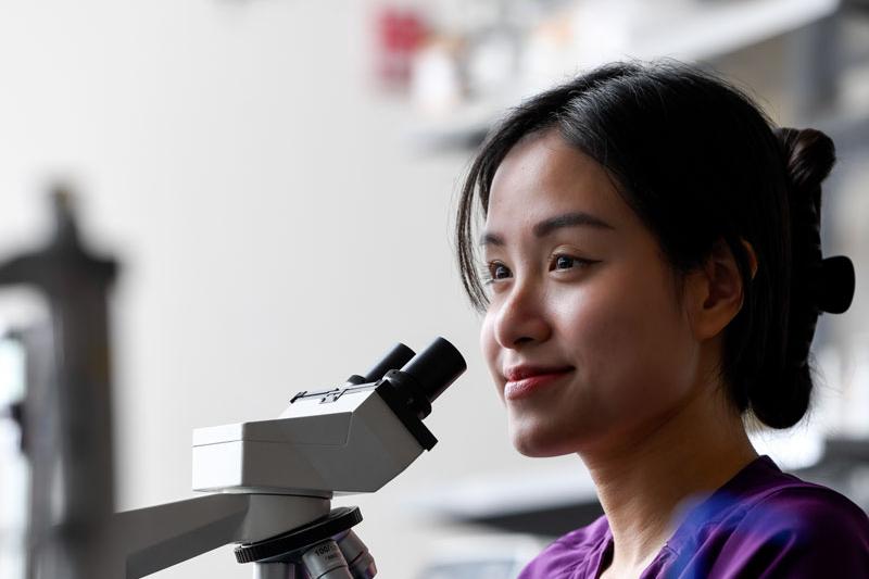 MLS student smiling in lab