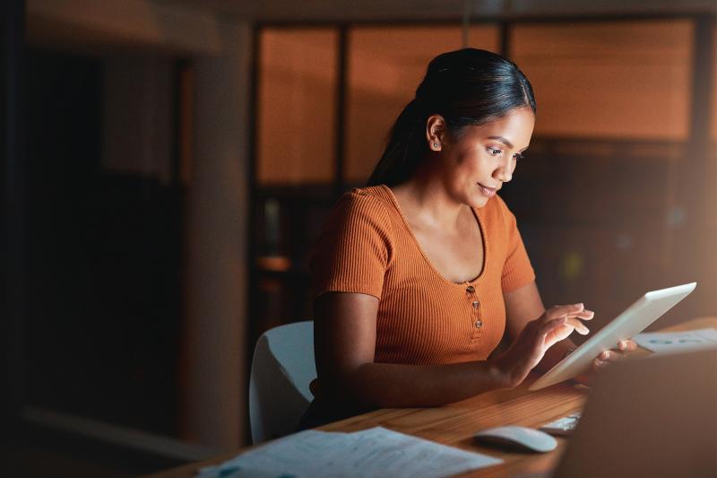 Young Woman Reading on a Tablet