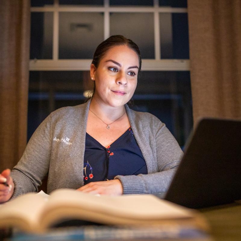 Nurse studying on a laptop