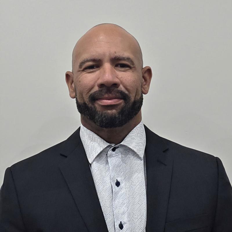 Male faculty member smiling