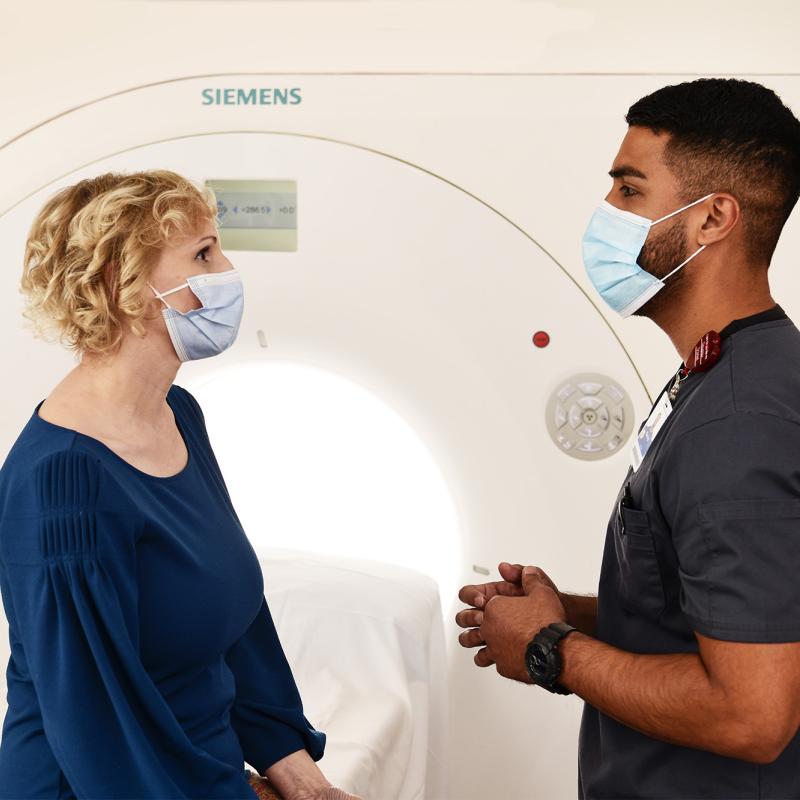 Provider speaking to CT scan patient