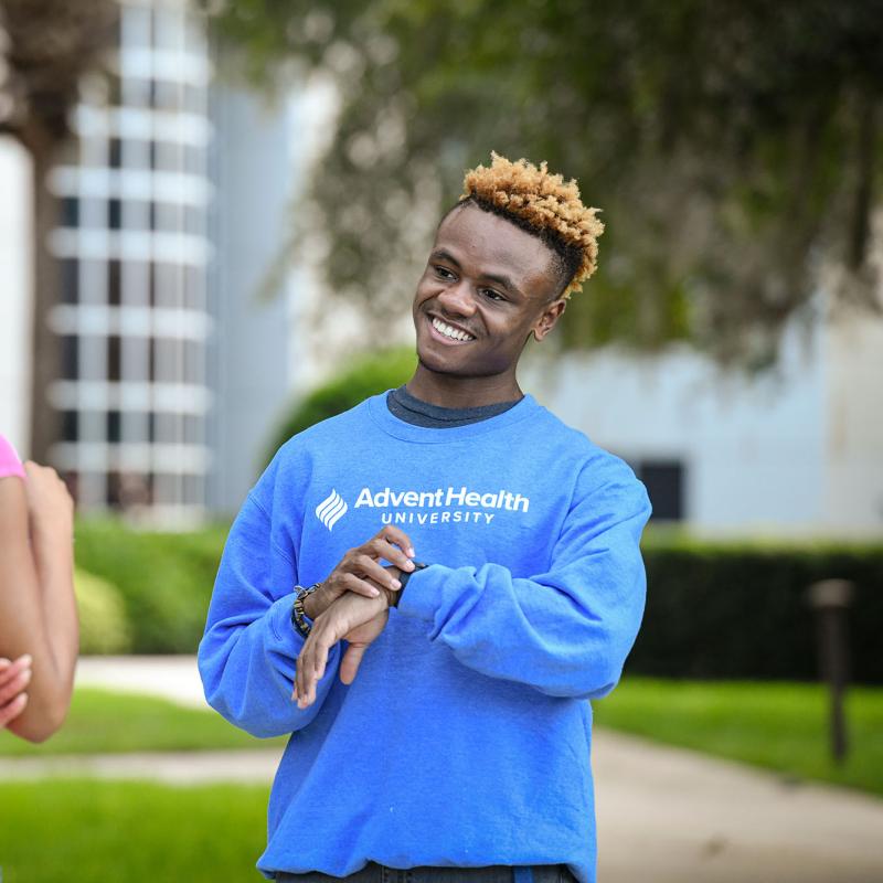 A student wearing an AHU sweater