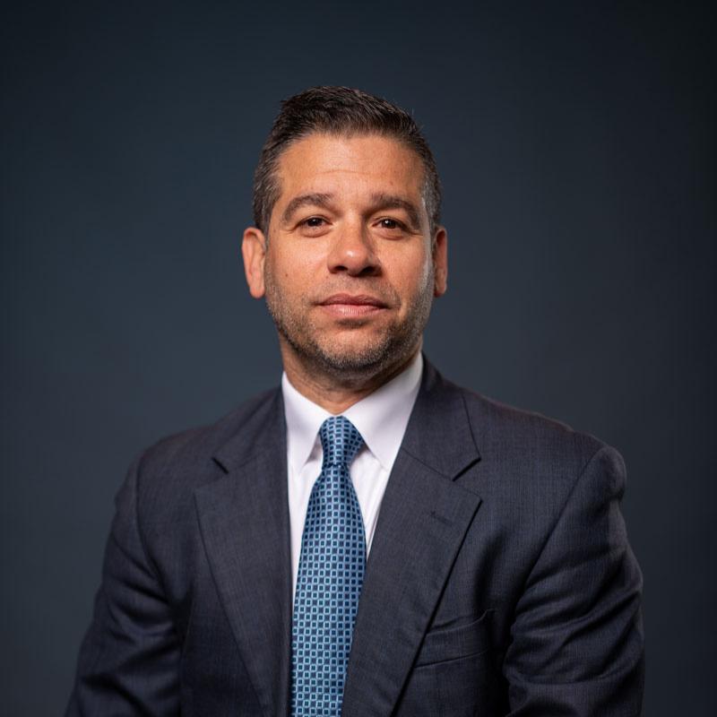 Board of trustees member smiling