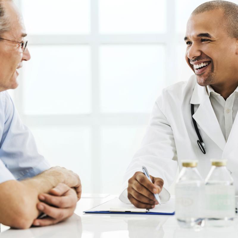 Older patient talking with doctor
