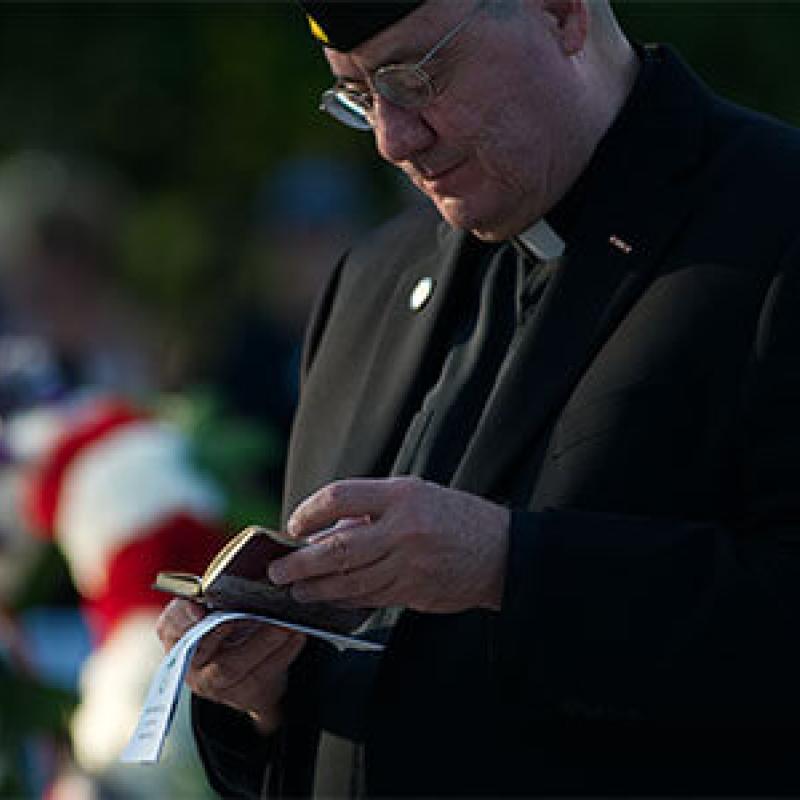 Military Chaplain reading a bible