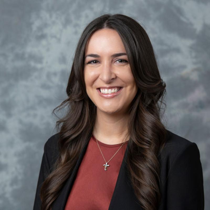 Faculty member smiling