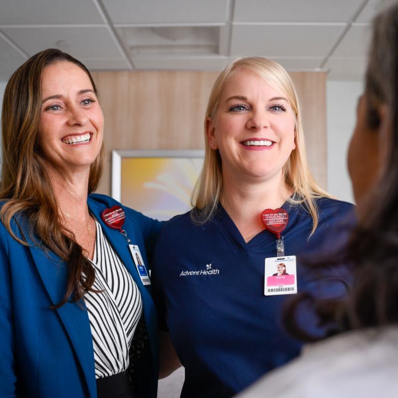 Two nursing leaders smiling in hospital room