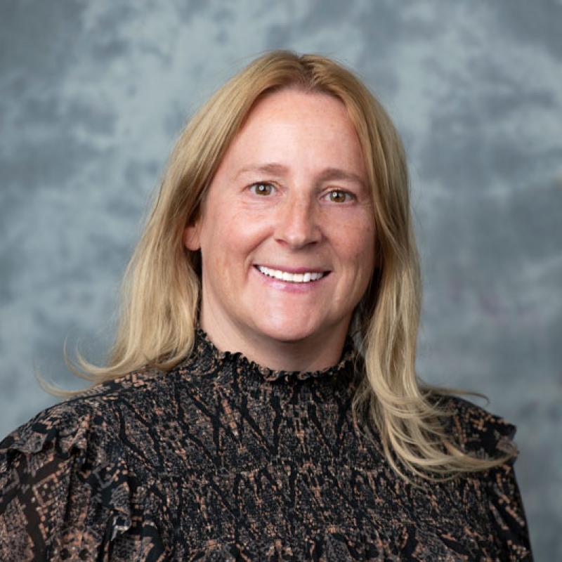 Faculty member smiling