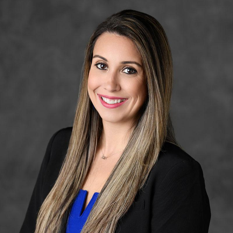 Faculty member smiling