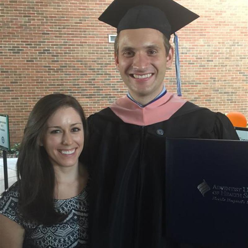 image of male graduate and woman smiling