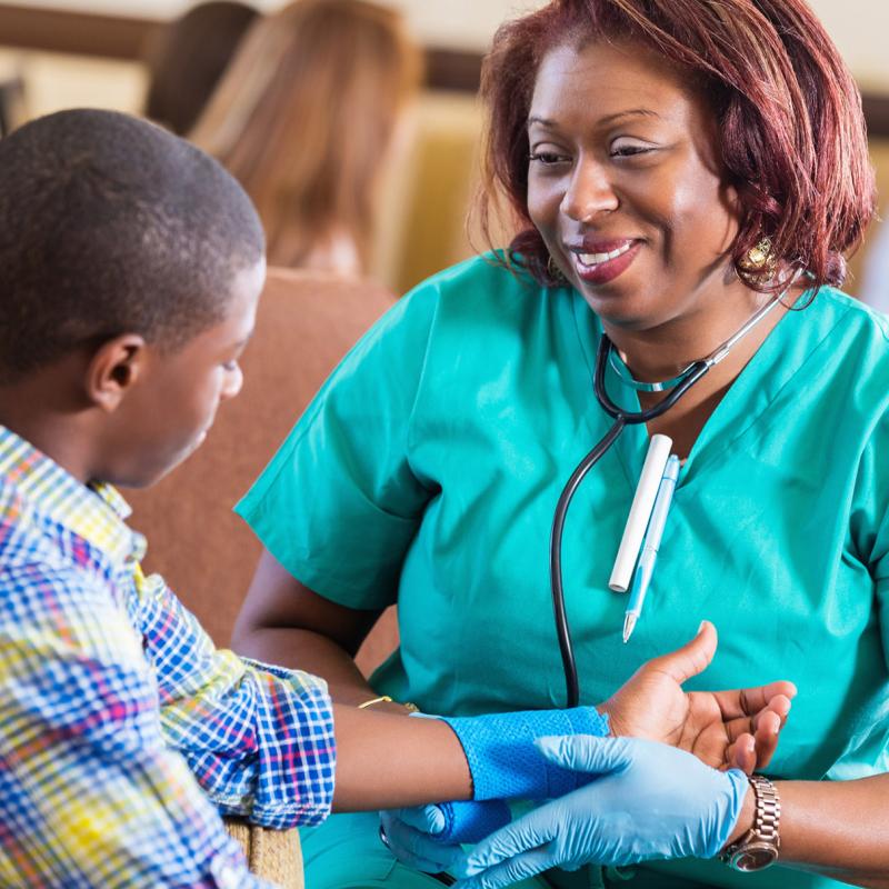 nurse examining boy