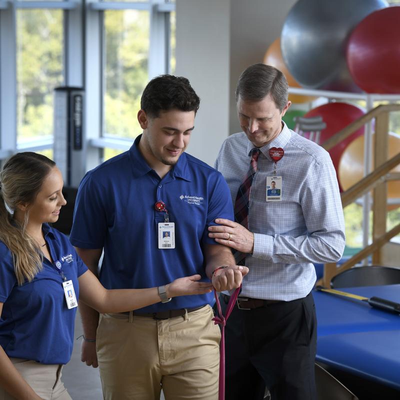 Physical Therapy students using an exercise band