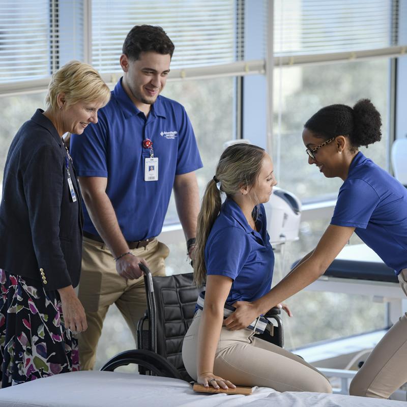 Physical Therapy students and professor demonstrating wheelchair use