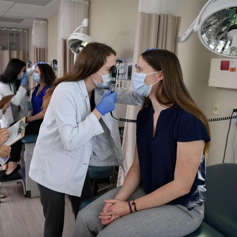 Physician assistant students practicing examinations on each other