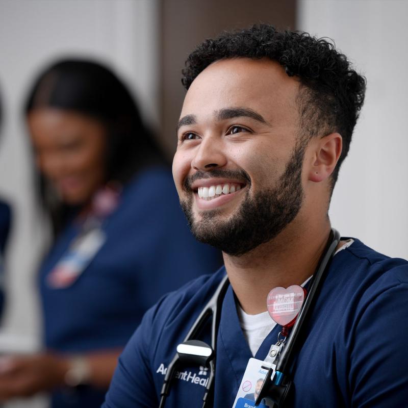 A young male nurse smiling