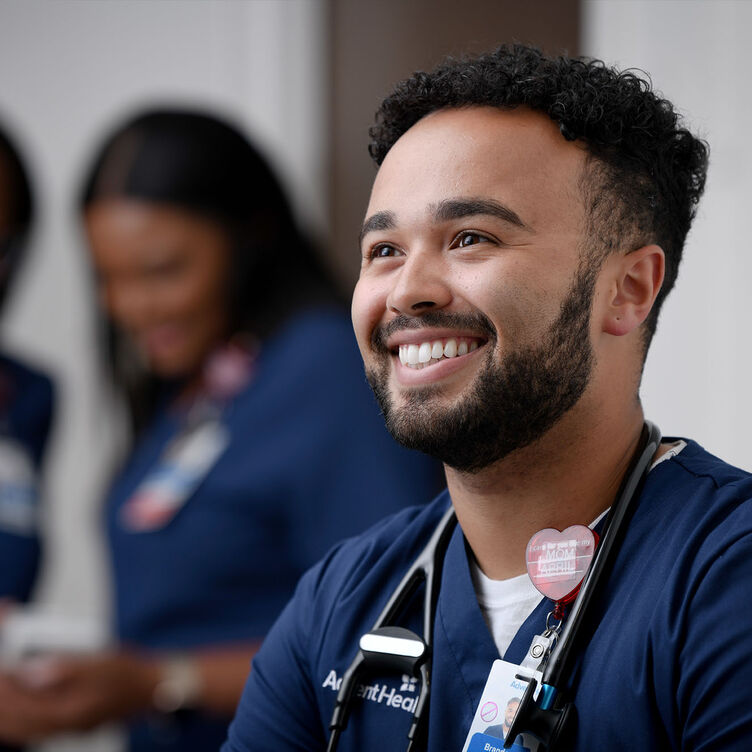 A young male nurse smiling