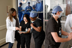 Students scrubbing into a surgical simulation