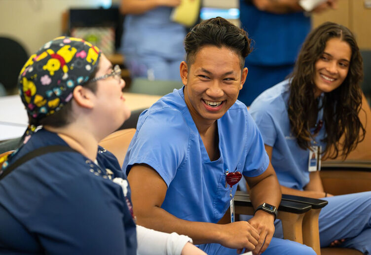 Nursing interns conversing with each other