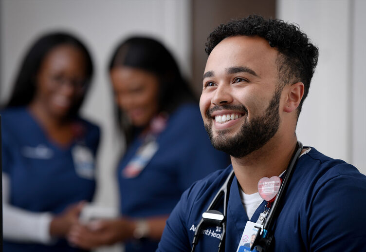 A young male nurse smiling