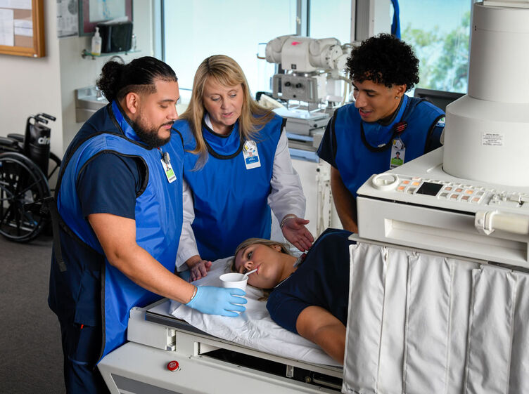 professor and students in radiography lab